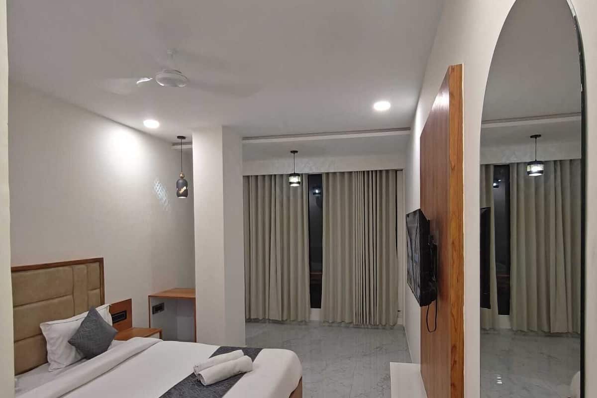 Quarto executivo, vista para a cidade | 1 quarto, camas com colchões de espuma com sistema de memória