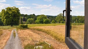 A rural landscape with a gravel path, trees, and a clear sky. - 1 bedroom accommodation in Nether Wallop, Stockbridge (Nether Wallop, Stockbridge)