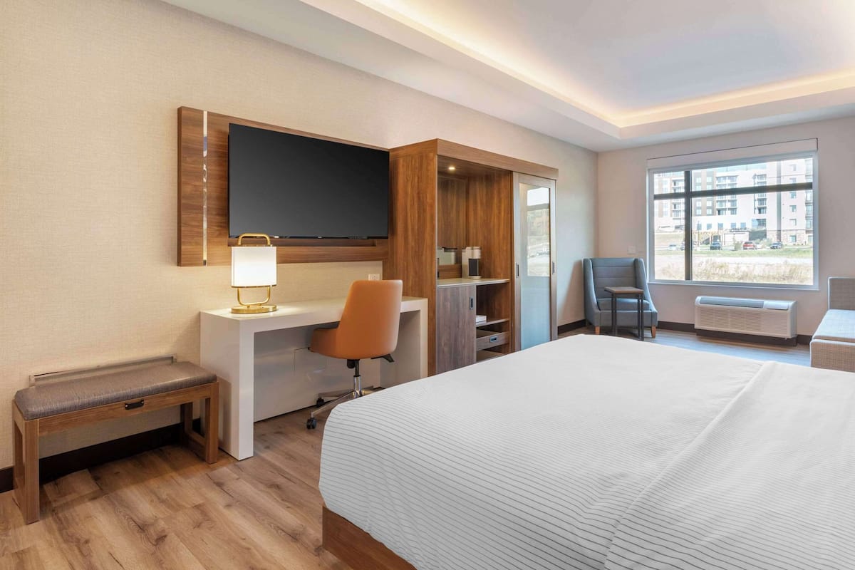 Premium bedding, desk, laptop workspace, blackout curtains