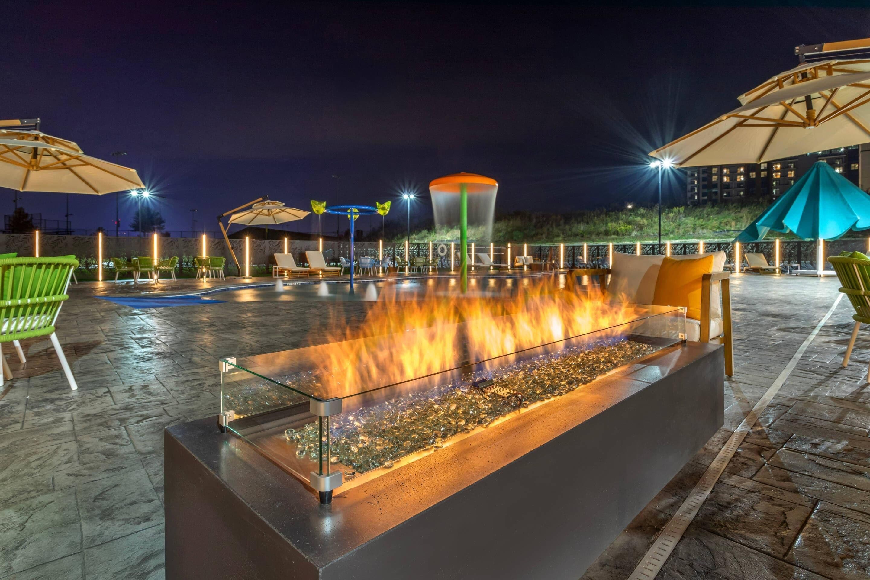 Seasonal outdoor pool, open 7:00 AM to 10:00 PM, pool umbrellas