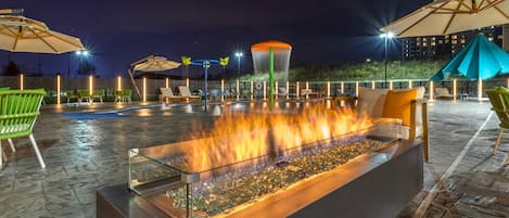 Seasonal outdoor pool, open 7:00 AM to 10:00 PM, pool umbrellas