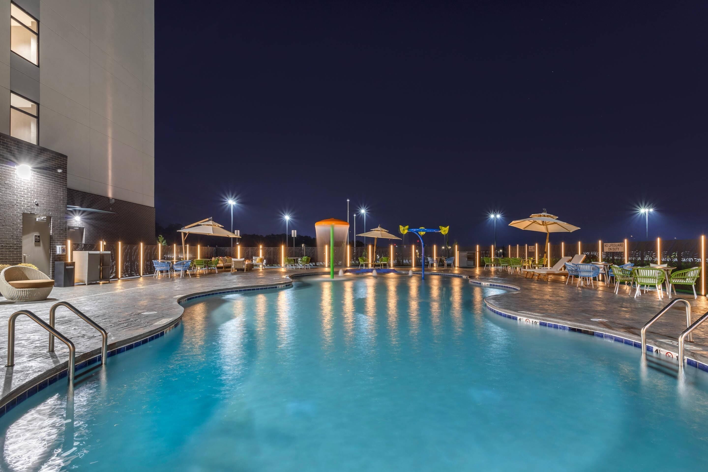 Seasonal outdoor pool, open 7:00 AM to 10:00 PM, pool umbrellas