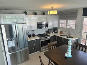 Fridge, microwave, stovetop, coffee/tea maker