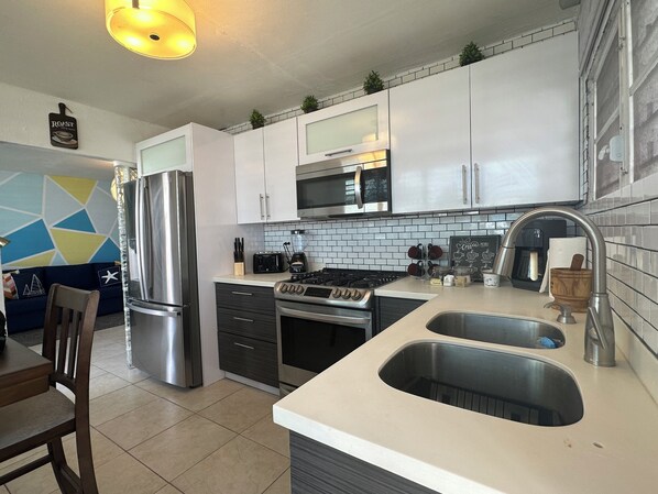 Fridge, microwave, stovetop, coffee/tea maker