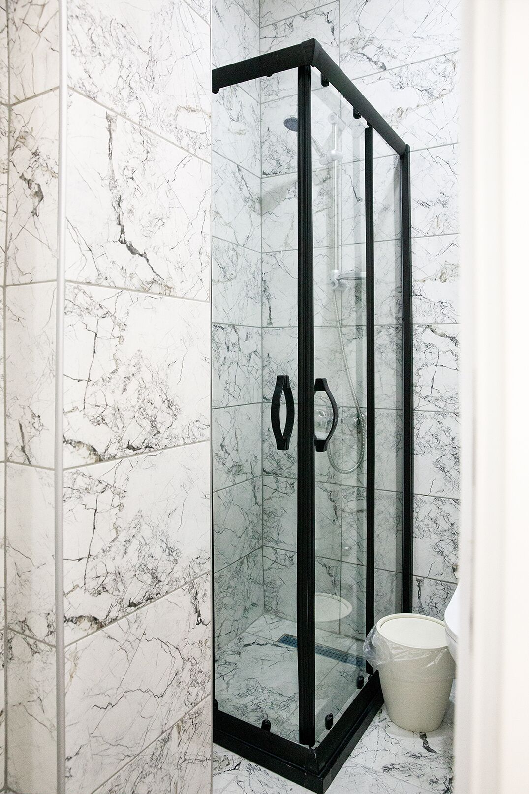 Economy Room | Bathroom | Shower, hair dryer, slippers, towels