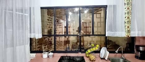 Fridge, microwave, stovetop, coffee/tea maker