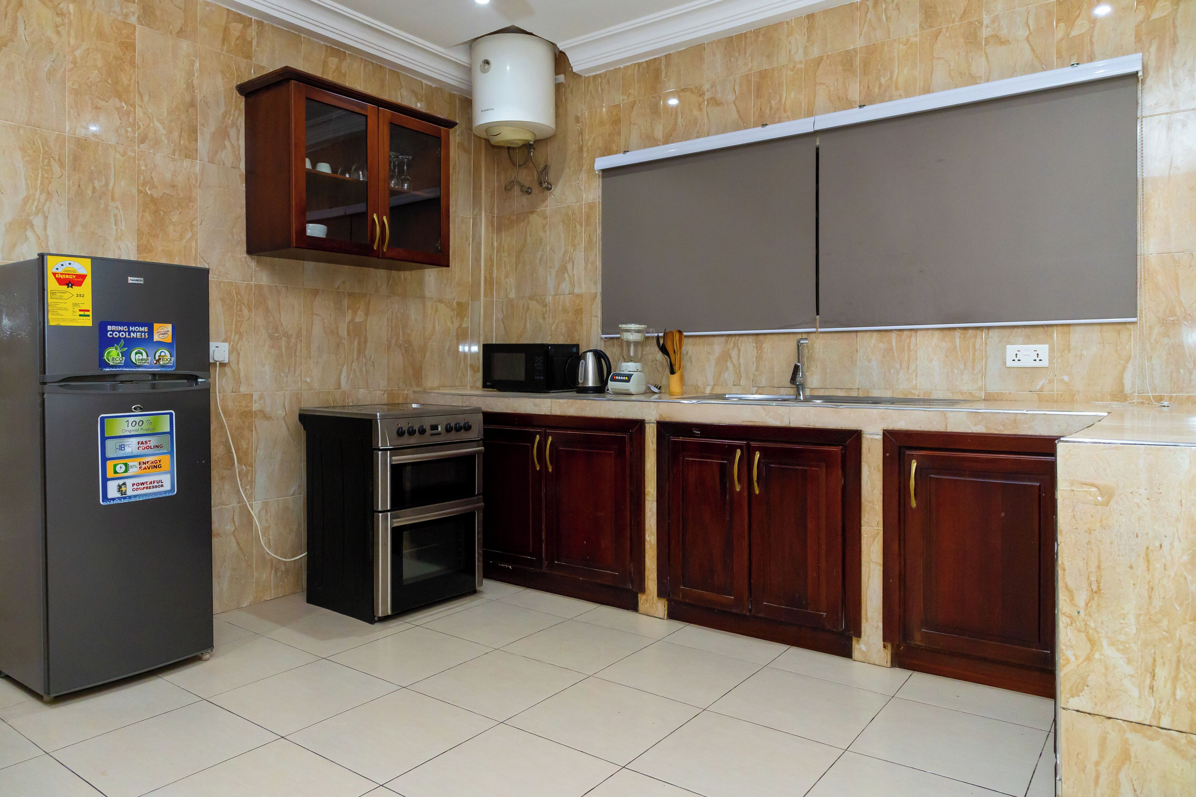 Deluxe Apartment, Courtyard View | Private kitchen | Full-size fridge, microwave, electric kettle, freezer