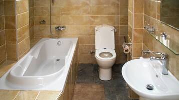 Combined shower/tub, towels, toilet paper