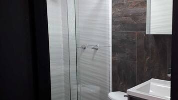 Economy Quadruple Room, Multiple Beds, Patio, City View | Bathroom | Free toiletries, towels, soap, shampoo