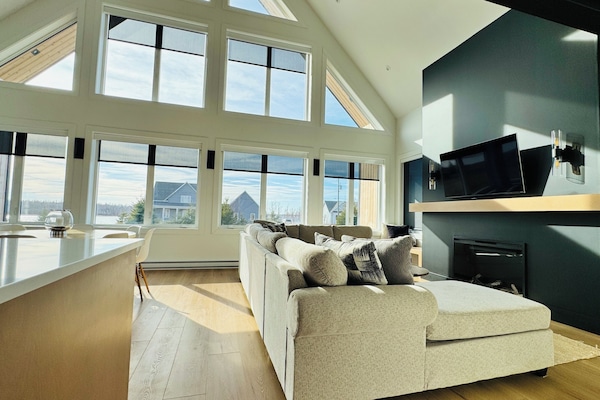 Relax in a spacious, bright and cozy family room with beautiful water views.
