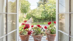 A view from a window with a garden in the background. - Olive Cottage, Wickham Market (Wickham Market)
