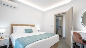 A modern bedroom with a bed, bedside table, and a desk with a chair. - Apartment 'Velvet  1' with Mountain View, Wi-Fi and Air Conditioning (RHODES)