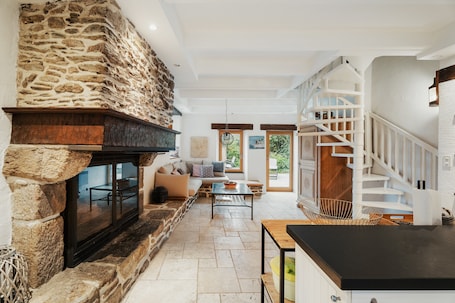 Fireplace. Apartment 'Maison Mer' with Sea View, Shared Terrace and Private Garden