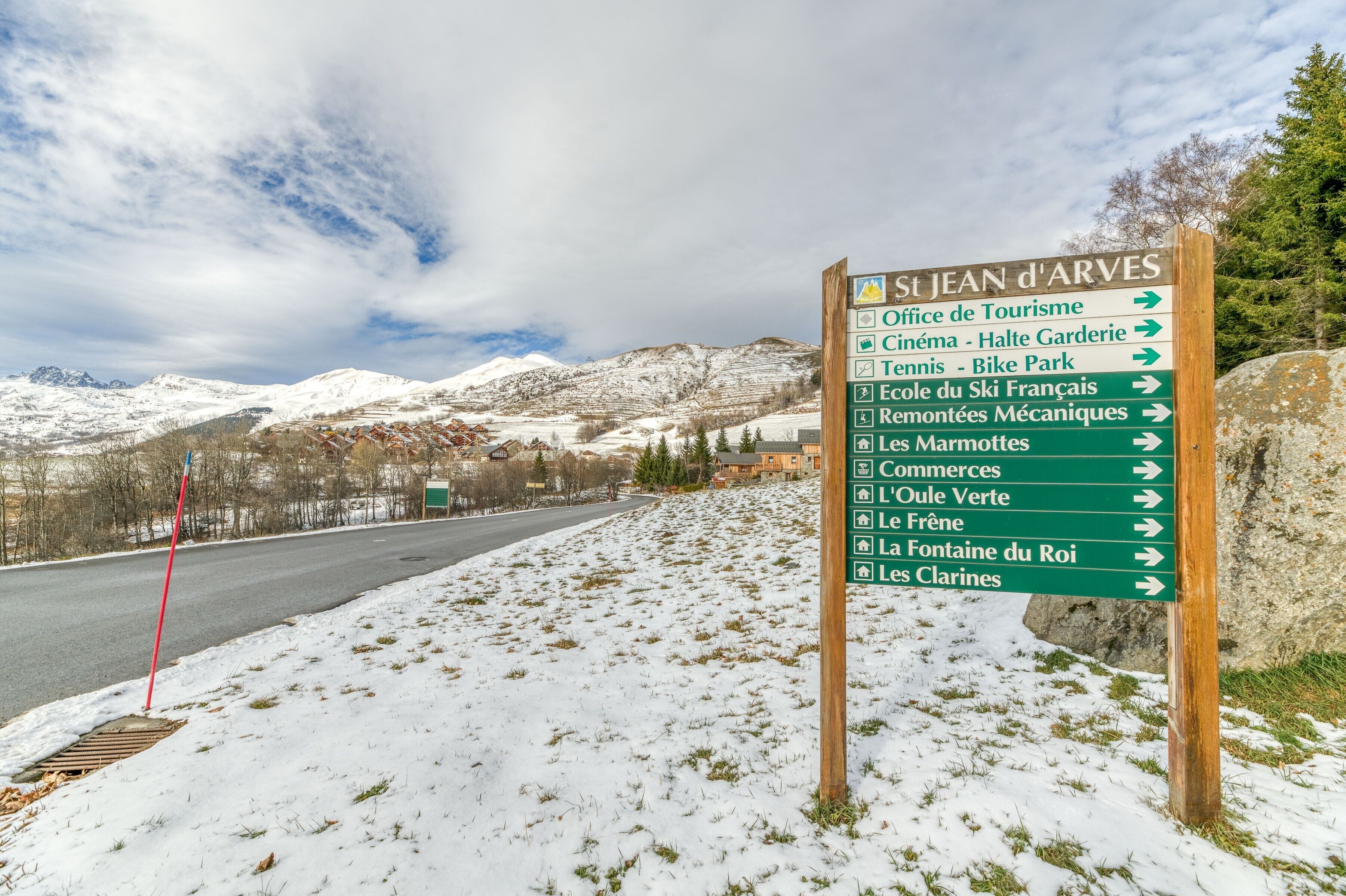 A directional sign with multiple arrows pointing to various destinations.