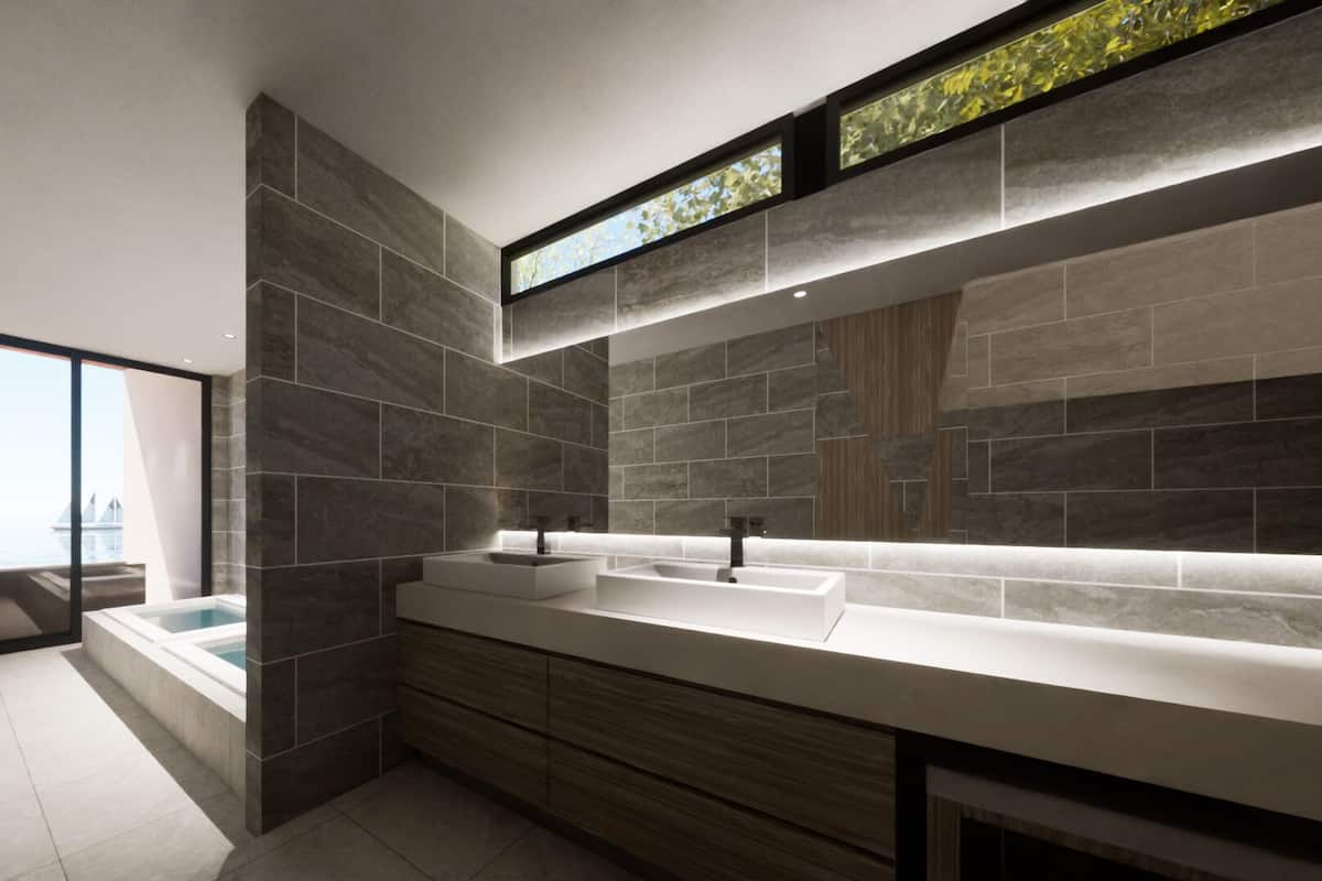 Une salle de bain moderne dotée d’un grand miroir, de deux lavabos, d’une baignoire et offrant une vue sur le paysage urbain grâce à une grande fenêtre.