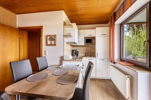 A compact kitchen with a microwave, toaster, and sink. - Haus Schönblick - "Apartment 9" with Mountain View, Balcony and Wi-Fi (Willingen (Upland))