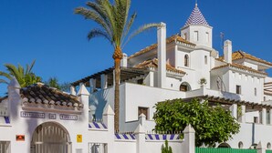 A white building with a tiled roof, a bell tower, and a sign reading "Privilegio de Marbella". - Privilegio de Marbella near Puerto Banus (Marbella)