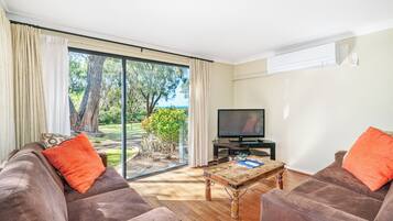 Comfort House, Multiple Beds, Non Smoking, Beach View | Living area | 55-inch flat-screen TV with satellite channels