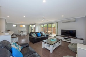 Deluxe House, Multiple Beds, Non Smoking | Living area | 65-inch TV with digital channels, DVD player - Maggie's Beach House (Broadwater)