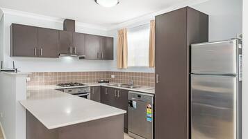 Comfort House, Multiple Beds, Non Smoking | Private kitchen | Full-size fridge, microwave, oven, stovetop
