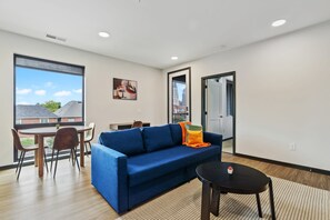 Deluxe Apartment | Living area | 42-inch Smart TV with digital channels - CozySuites on Mass w garage parking 20 (Indianapolis)