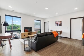 Deluxe Apartment | Living area | 42-inch Smart TV with digital channels - CozySuites on Mass w garage parking 20 (Indianapolis)