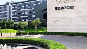 A modern building with a sign reading "Virgin Active BOUNCE".