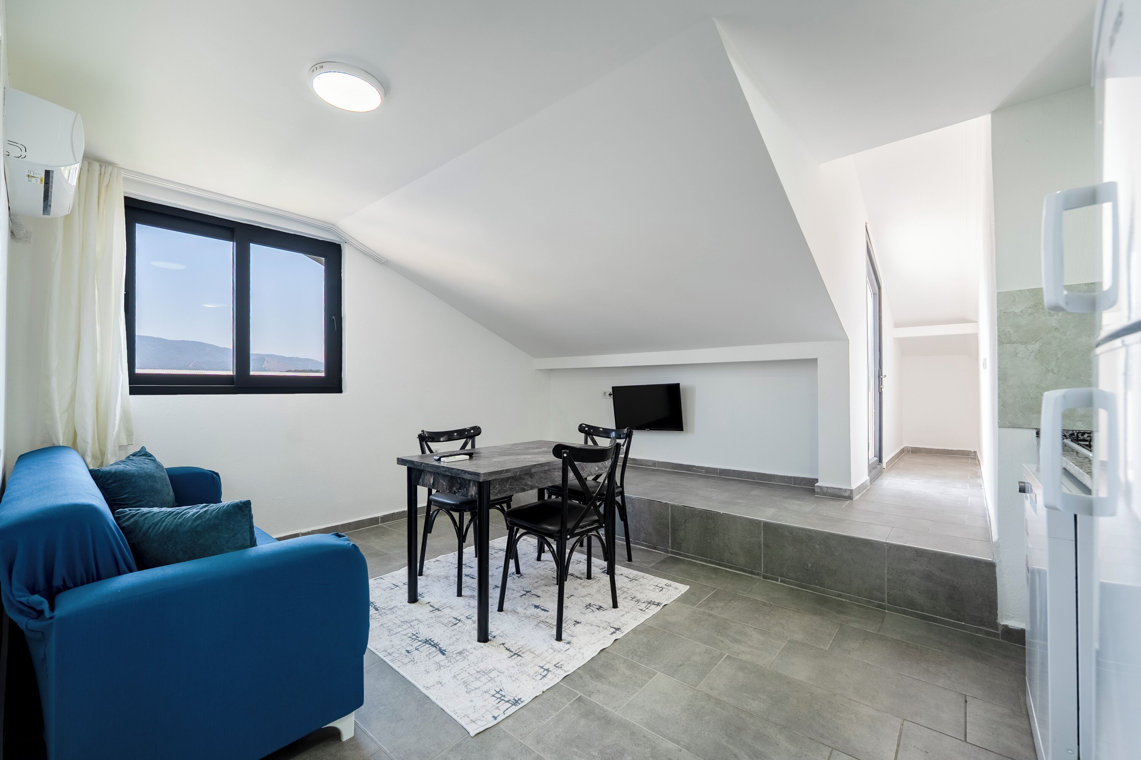 Apartment, Garden View | Living area | 42-inch Smart TV with satellite channels