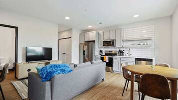 Deluxe Apartment | Living area | 42-inch Smart TV with digital channels