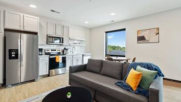 Deluxe Apartment | Living area | 42-inch Smart TV with digital channels