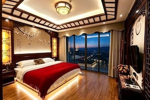 A bedroom with a large bed, a city view, and traditional decor.