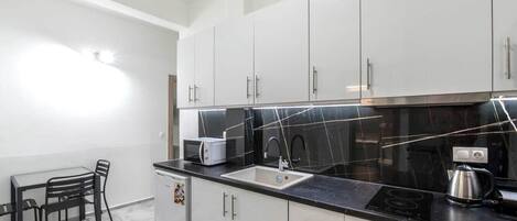 Microwave, stovetop, coffee/tea maker, toaster