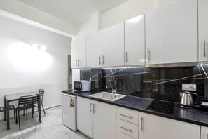 Microwave, stovetop, coffee/tea maker, electric kettle