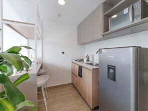 Fridge, microwave, stovetop, coffee/tea maker