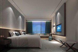 A modern hotel room with a large bed, a TV mounted on the wall, and a window with curtains. - Jinyu Rose Manor Hotel (Yanling)