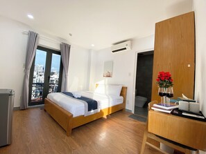Deluxe Double Room, Balcony, City View | Desk, laptop workspace, soundproofing, iron/ironing board