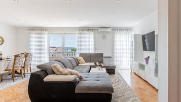 Apartment (Two Bedroom Apartment with Balcony) | Living room | 32-inch flat-screen TV with digital channels