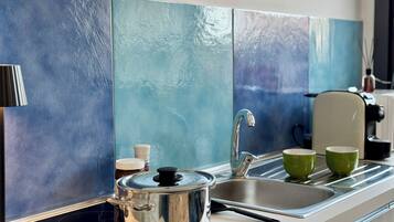 Deluxe Studio, Courtyard View | Private kitchen | Espresso maker