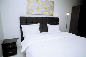 Basic Double Room Single Use, 1 Bedroom, City View | Premium bedding, down comforters, memory foam beds - Buffalo Village (Kigali)