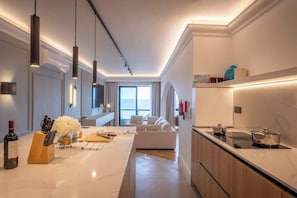 Fridge, stovetop, dishwasher, coffee/tea maker