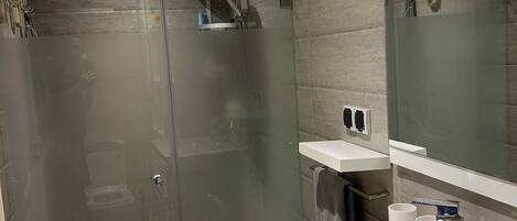 Shower, towels, soap, toilet paper