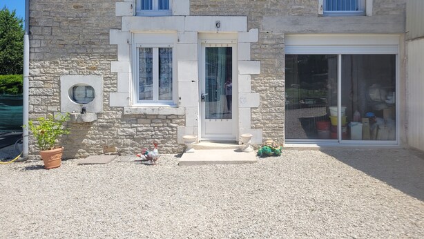 A stone building with a central door, two windows on the upper floor, and a large sliding glass door on the right. - La Cadole House surrounded by a vineyard. Panoramic trails. (Baroville)