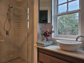 Shower, hair dryer, towels, soap