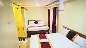 A hotel room with two beds, a bathroom, and a corridor. - Sky Park Lounge (Nairobi)