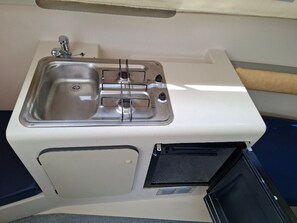 Fridge, stovetop, coffee/tea maker