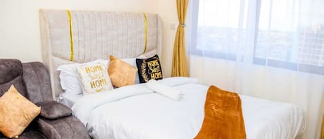 Departamento | 1 habitación, tabla de planchar con plancha, wifi gratis y ropa de cama
