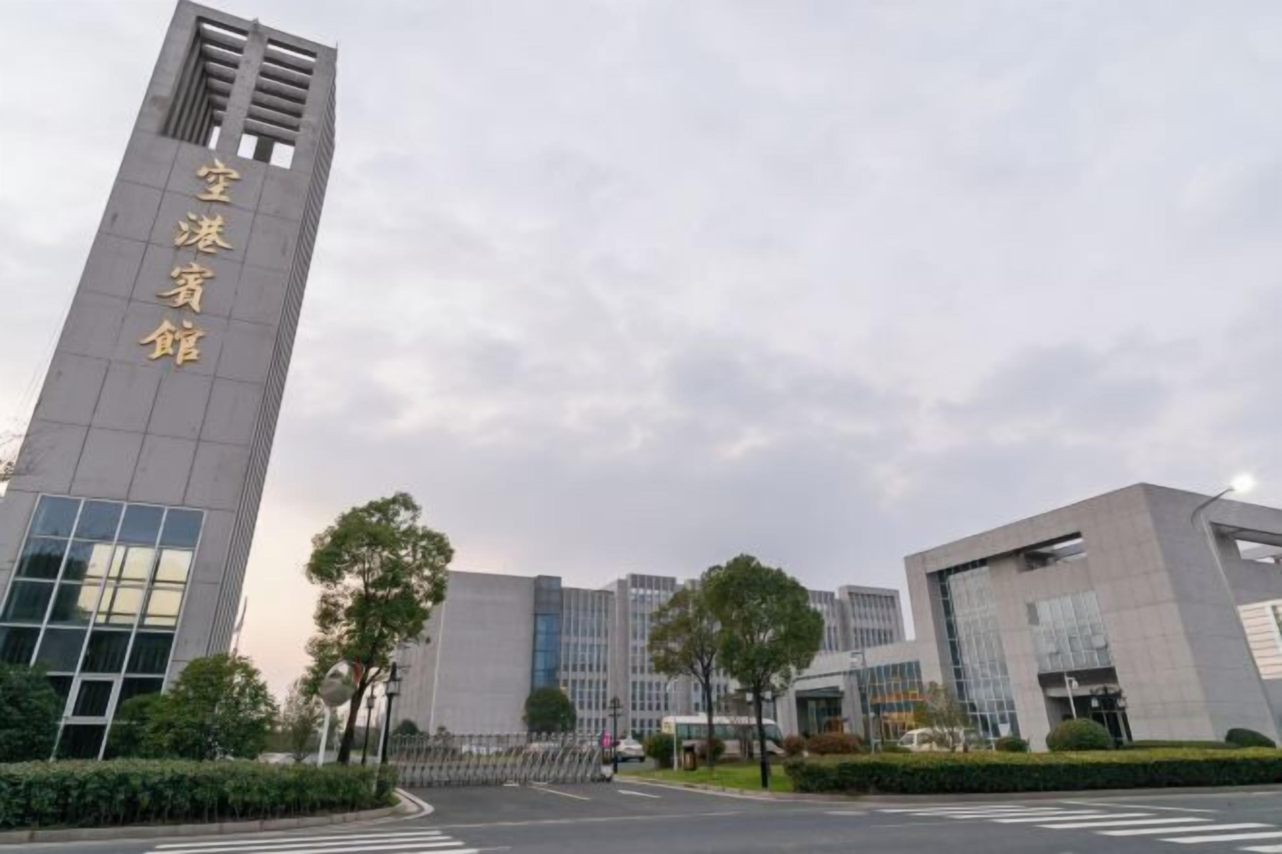 A modern building with a prominent vertical sign.