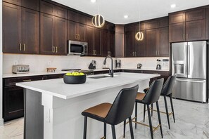 Fridge, microwave, oven, stovetop - The Oasis | NEW Villa Near Parks w Toy Theme BR, Luxe LR/DR, Full Kitchen & Pool (Orlando)