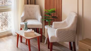 Superior Double Room, City View | Living area | TV, fireplace