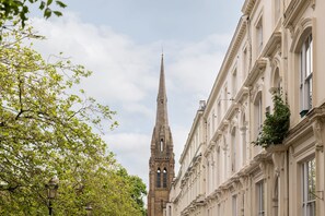 A historic building with a tall, pointed tower and classical architecture. - Host Stay Princes Place Apartments (Liverpool)